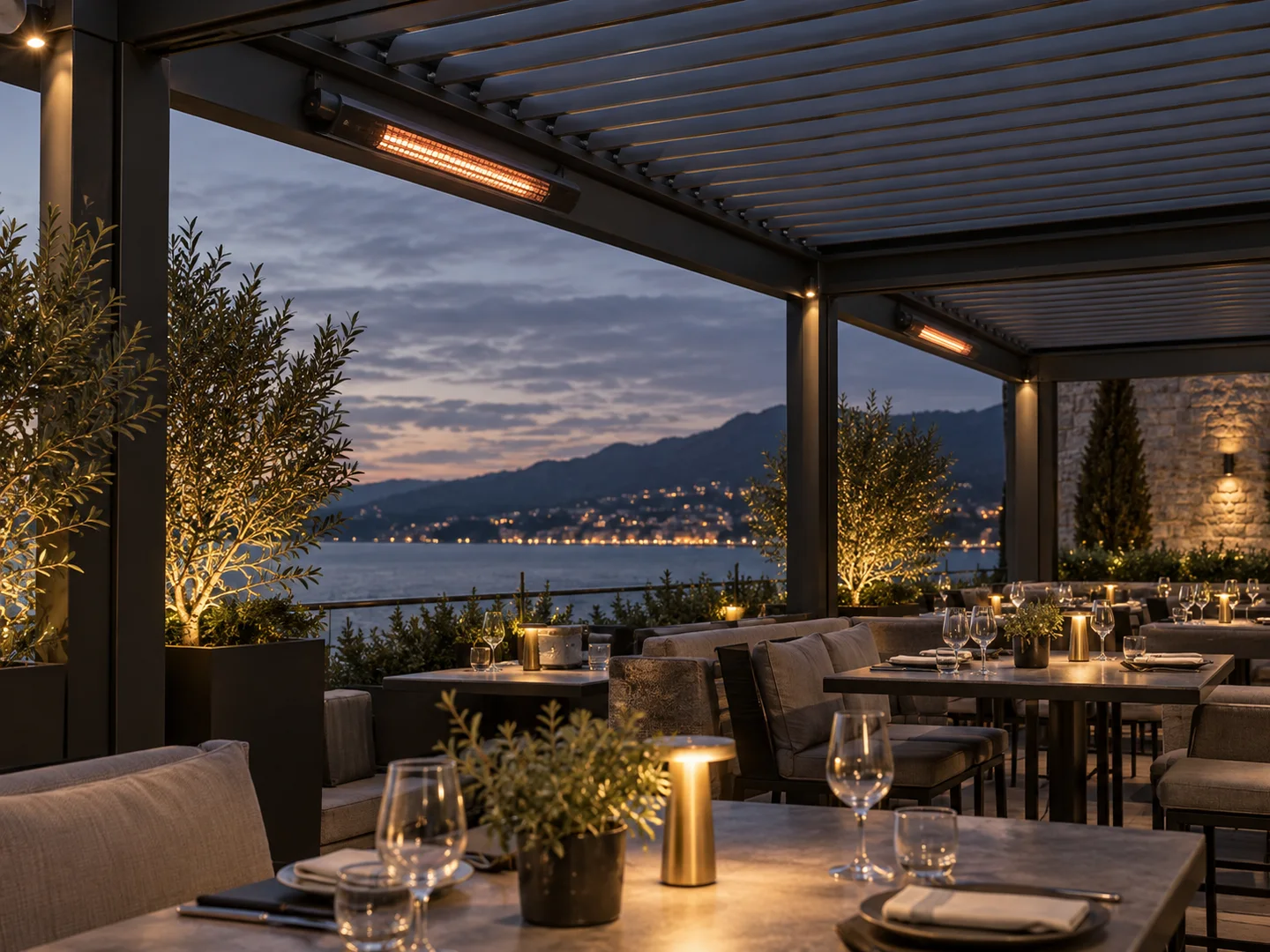 Slim infrared heaters mounted to pergola beams above a restaurant terrace