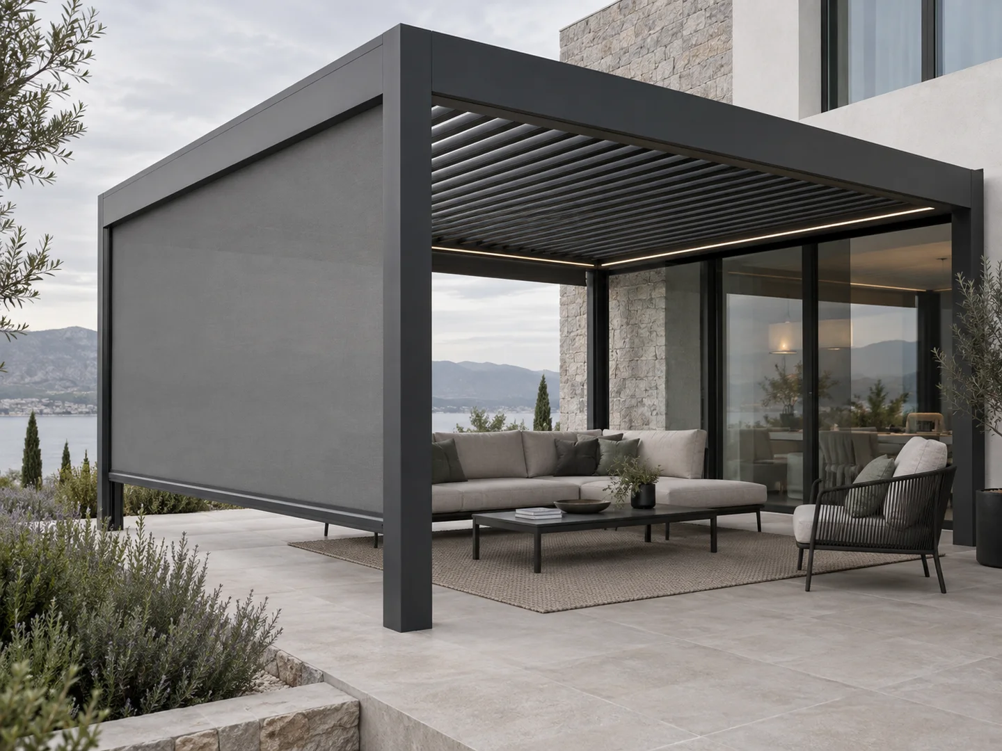 Motorized gray ZIP screen guided within a charcoal aluminum pergola frame